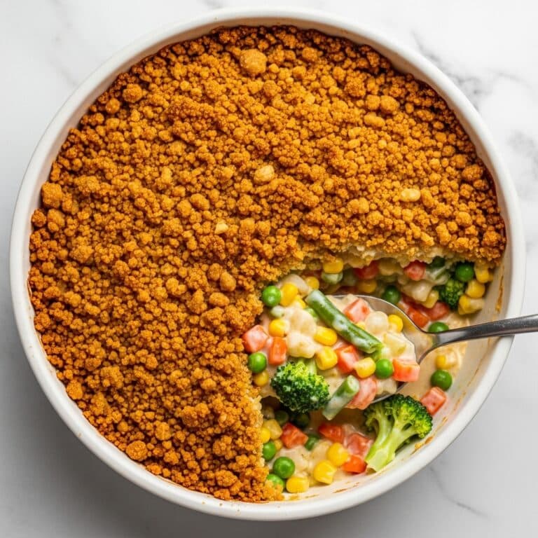 Creamy Vegetable Casserole with Cheddar, Rice, and Ritz Cracker Topping Recipe